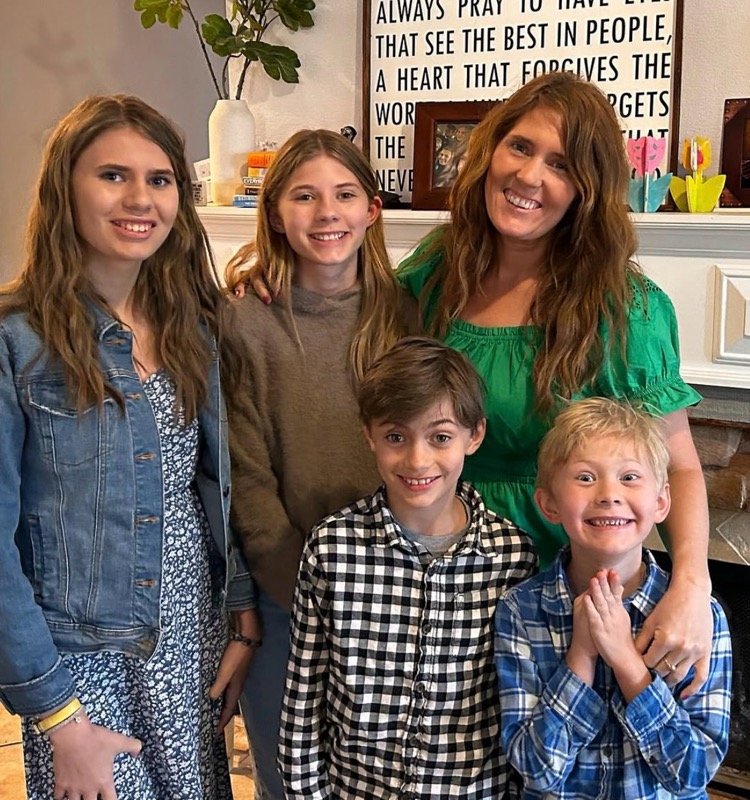 Lori Pappin smiling together at home with her four children