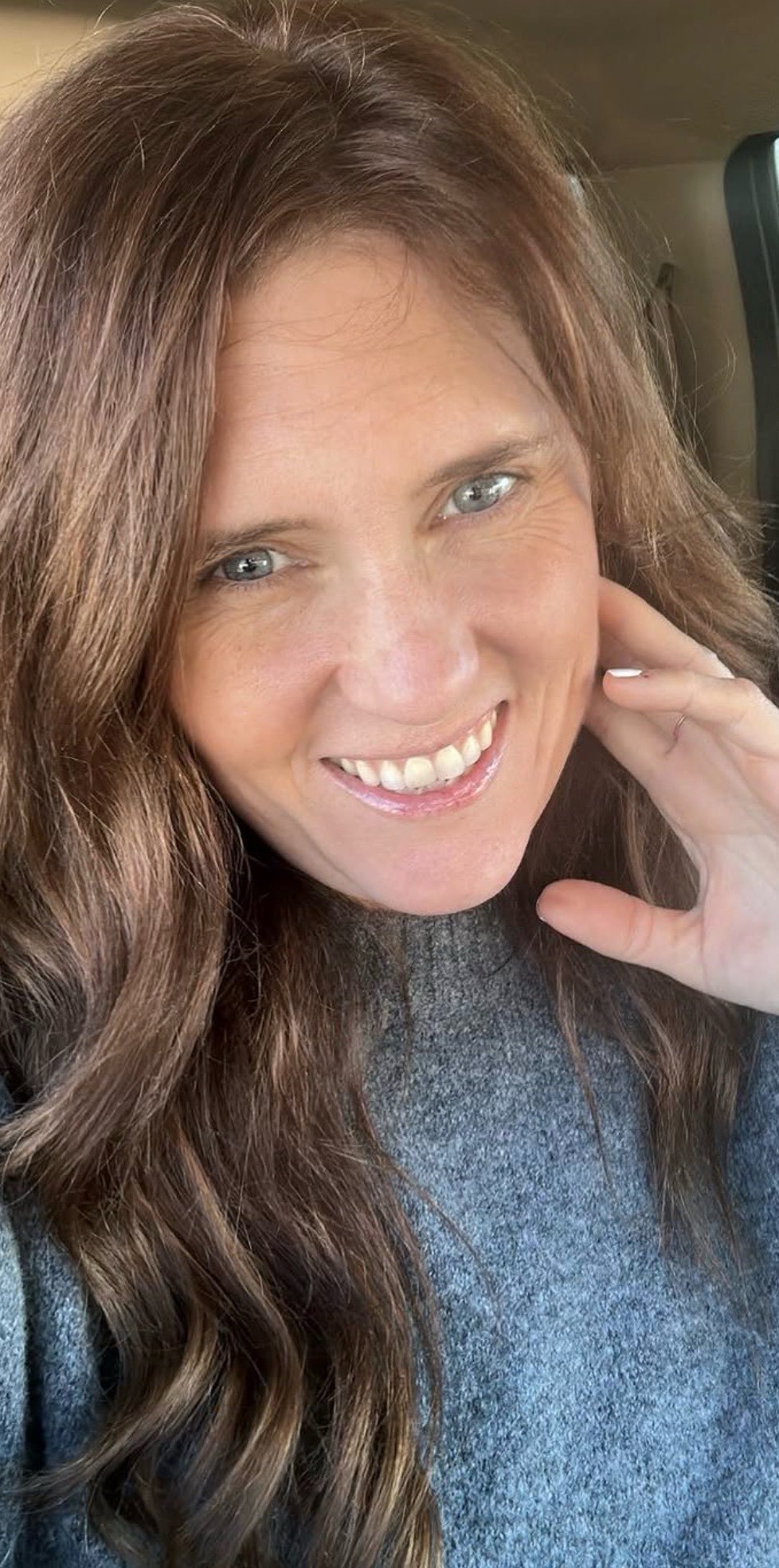 Lori Pappin in a cozy gray knit sweater